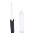The Round Lip Gloss Bottle features a sleek and modern design, with a transparent tube and a black cap standing beside its open, clear cylindrical container. The white sponge tip of the applicator extends from the attached cap, while the container itself remains empty.