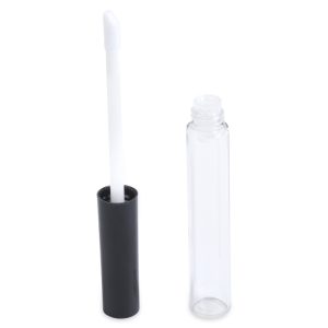 The Round Lip Gloss Bottle features a sleek and modern design, with a transparent tube and a black cap standing beside its open, clear cylindrical container. The white sponge tip of the applicator extends from the attached cap, while the container itself remains empty.