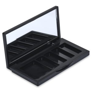 The 5 Well Rectangular Compact, a black, rectangular makeup palette, is shown open with multiple empty compartments. The inner lid features a built-in mirror reflecting part of the compact, and the compartments are designed to hold various makeup products such as eyeshadows or blushes.