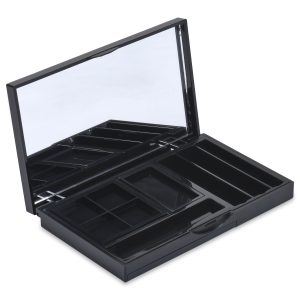 The 9 Well Rectangular Compact is an open black makeup organizer featuring a mirror on the inside of the lid. It boasts multiple compartments of various sizes for storing cosmetics or accessories. The lid is propped open, revealing the empty compartments inside.