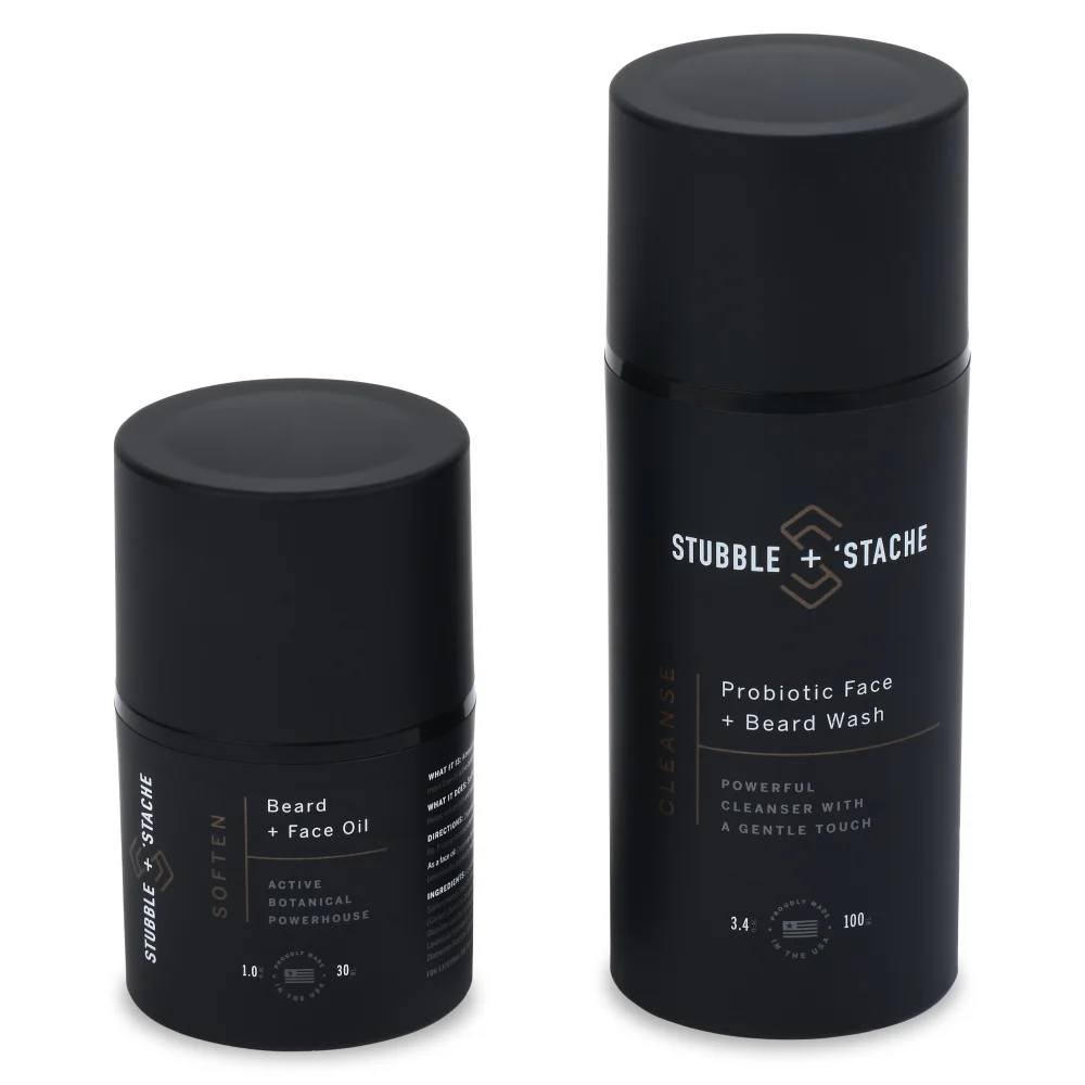 Two black cylindrical beauty product containers. The right container is taller than the right container.